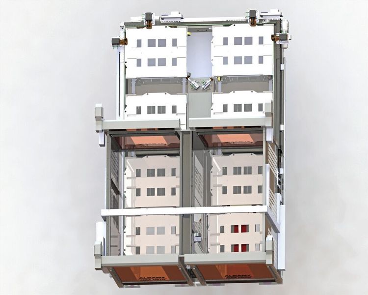 Die Schleusenanlage von oben, unten rechts Einfahrt, unten links Ausfahrt, mit jeweils zwei leeren Bodenrollern in der Schleuse und (oben) zwei zwischen Schleuse und Fertigungslinie.  (CPS)