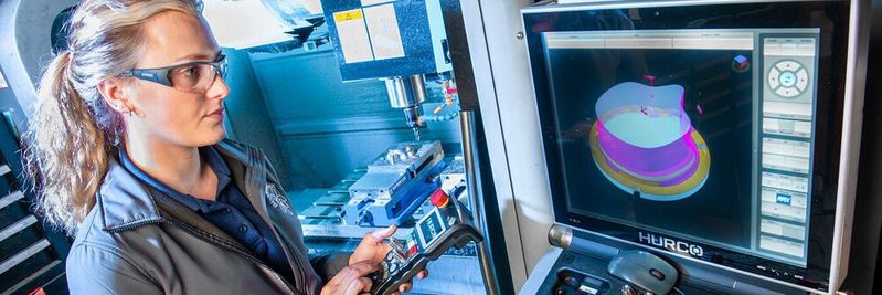 Hannah Reardon programming a face mask on the Hurco machining centre Hannah Reardon programming a face mask on the Hurco machining centre