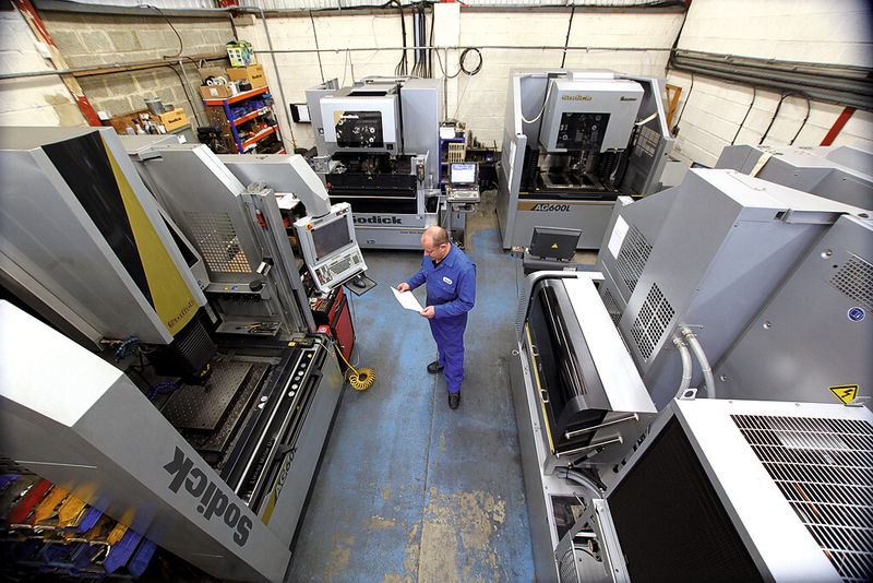 It’s all in a picture. A worker at the AJM shop surrounded by Sodick EDM units. (Source: Sodick)