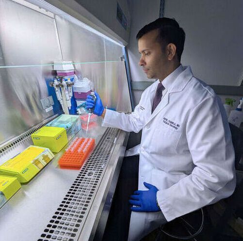 Study senior author Dr. Akhil Chawla, a complex surgical oncologist, working in his lab at Northwestern University Feinberg School of Medicine in Chicago. (Source:  Ben Schamisso / Northwestern University)