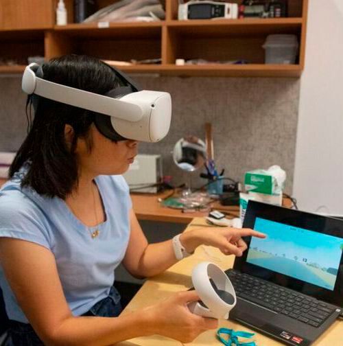 Hongbian Li, a research associate in Nanshu Lu's lab, wearing a Meta VR headset equipped with a noninvasive EEG sensor. Hongbian Li, a research associate in Nanshu Lu's lab, wearing a Meta VR headset equipped with a noninvasive EEG sensor.