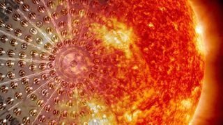 Das Innere des Borexino-Detektors mit den Lichtsensoren zum Registrieren des von Neutrinos ausgelösten Szintillationslichts und die Sonnenoberfläche. (Bild: Borexino-Kollaboration)