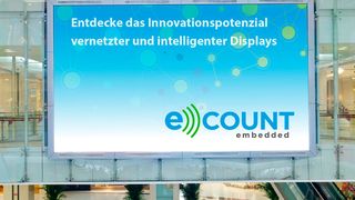 Ein Flachbildschirm im Kaufhaus. Sie hängen meist mehrere Meter über Grund und lassen sich nicht einfach erreichen. Eine Cloudanbindung bietet den Vorteil, dass sich das Modul zentral überwachen und steuern lässt. (Bild: eCOUNT)