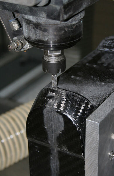 Carbon fibre electronic boxes being machined with PCD tooling. (Source: Open Mind)
