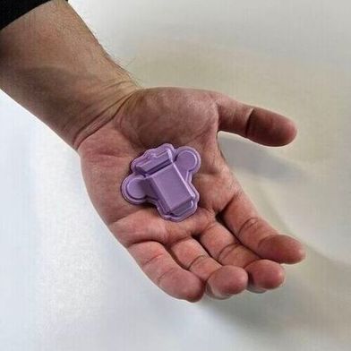 Wearable polygraph device in the palm of a hand for scale. (Source: John A. Rogers/Northwestern University)