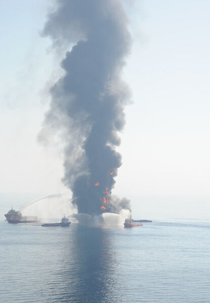 ... While assist vessels fire water cannons at the burning platform. (Picture: US Coast Guard)