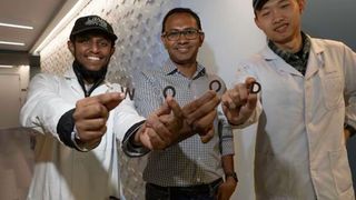 Muhammad Rahman (center), an assistant research professor of materials science and nanoengineering at Rice and his lab. (Source:Gustavo Raskosky/ Rice University)