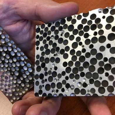 CMFs are foams that consist of hollow spheres – made of materials such as stainless steel, nickel, or other metals and alloys – embedded in a metallic matrix. The resulting material is both lightweight and remarkably strong at absorbing compressive forces. (Source: Jie Sun/ NC State University)