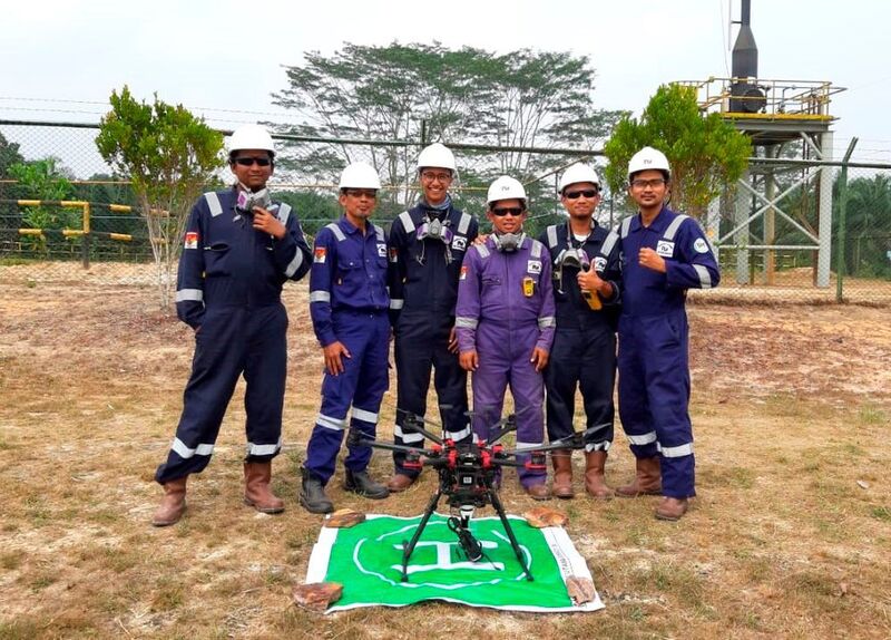 The Terra Drone team with an inspection drone.  (Terra Drone)