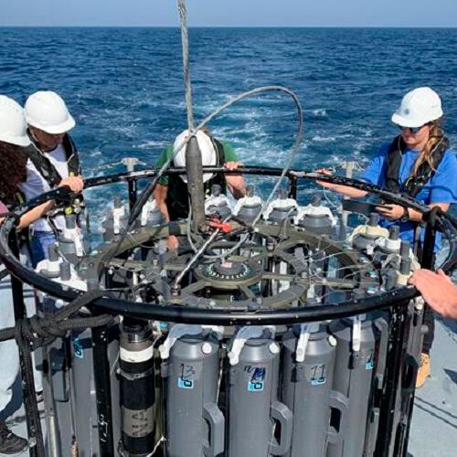 Kaust-Jamstec crew prepare to submerge a 24-point Rosette Water Sampling system into the Red Sea at Al-Wajh Reef to sample water and measure temperature-salinity. Kaust-Jamstec crew prepare to submerge a 24-point Rosette Water Sampling system into the Red Sea at Al-Wajh Reef to sample water and measure temperature-salinity.