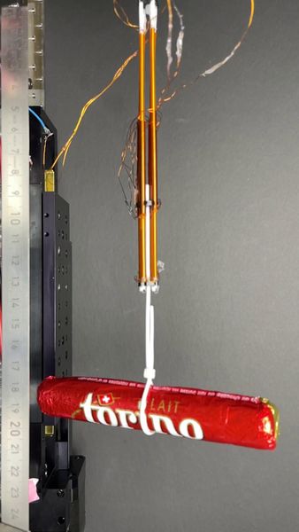 In laboratory demonstrations, individual FiberMotors were able to support stationary loads of about 75 grams. Four motors working in tandem generated enough force to lift a 46-gram chocolate bar and bend a cable-actuated robot finger. (Source: EPFL)