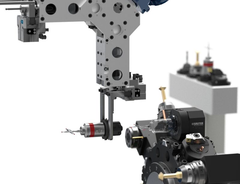 Ein Roboter-Greifer führt einen Werkzeugwechsel über den Sauter SolidPro aus. (Bild:  Sauter Feinmechanik)