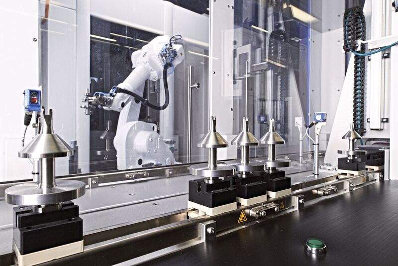 IMSTec manufactures automated production lines such as this one, which features a individually adapted robot grippers for the safe transport of medical components and products.  (VDW)