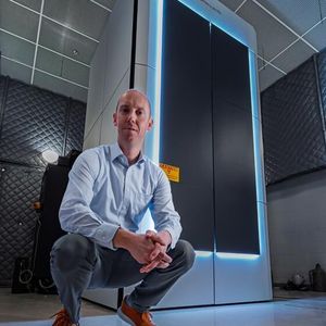 ORNL’s David Cullen stands in front of the new Thermo Scientific Spectra Ultra transmission electron microscope.(Source:  ORNL/ Carlos Jones, U.S. Dept. of Energy)