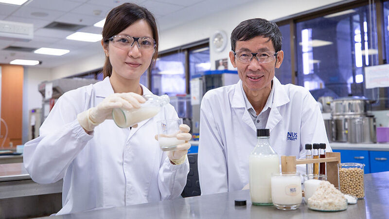 Associate Professor Liu Shao Quan and doctoral student Ms Vong Weng Chan from the NUS Food Science and Technology Programme have devised a unique cocktail of enzymes, probiotics and yeast to produce an okara beverage rich in gut-friendly nutrients. (NUS)