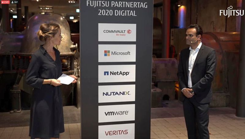 Moderatorin Julia Ures und der Fujitsu-Channelchef Santosh Wadwa eröffneten den ersten virtuellen Partnertag des Herstellers. (IT-Business)