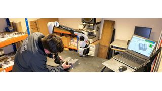 Ryan Leaves, who looks after inspection at GT Tooling, using the Fredom Classic Scan portable arm to inspect part of an aluminium extrusion blow mould for plastic bottle production. (Source: GT Tooling)