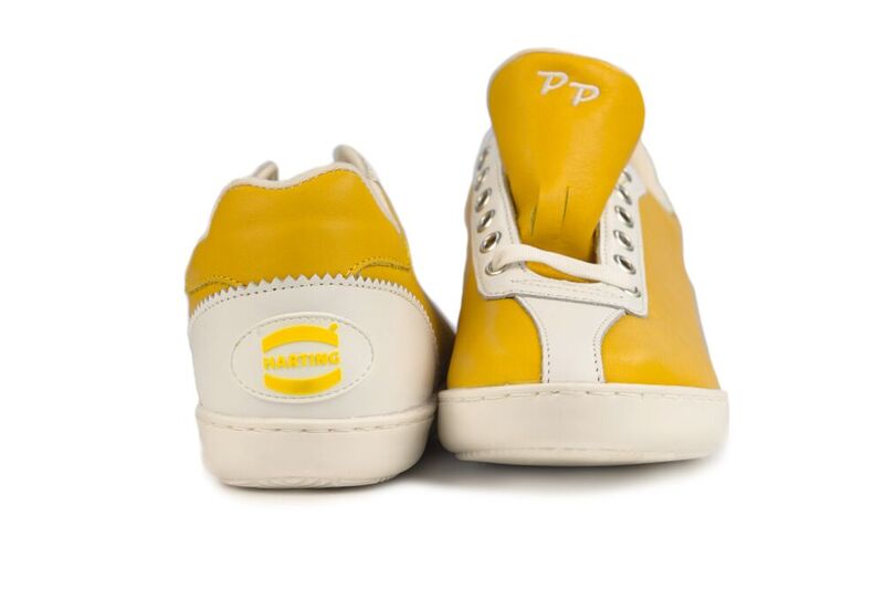 Nicht nur der Slogan "Pushing Performance" ist von Margrit Harting, sondern das gesamte Corporate Design - gelbe Sneaker inklusive.