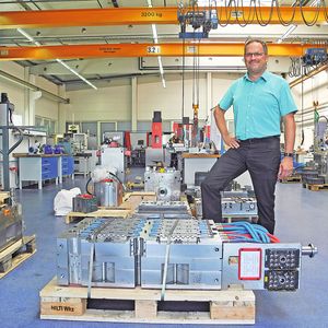 Wolfgang Faßnacht stands proudly with one of his shop’s tools.