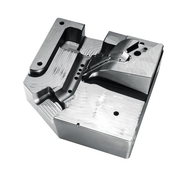 A mould insert made of 1.2343/52HRC which has been fully milled and drilled at the C 42, including cooling. After hardening, the mould insert was extensively milled in one setup. (Hermle)