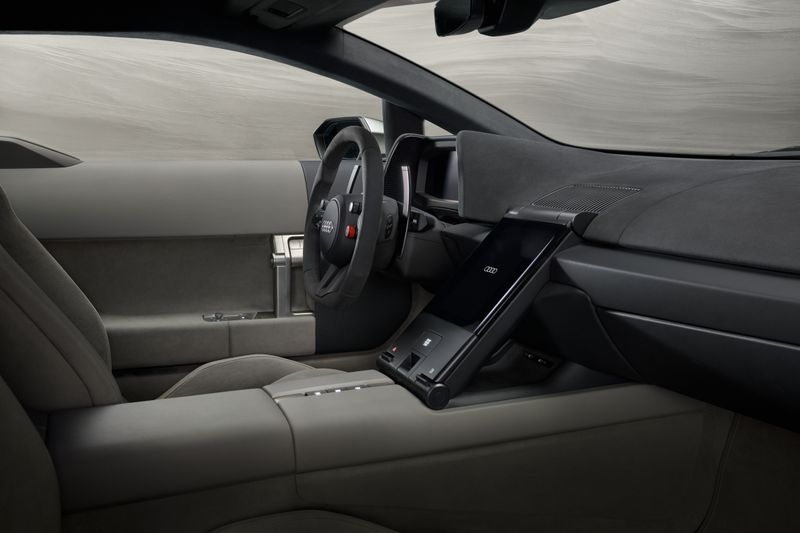 Der Innenraum ist minimalistisch gestaltet. Bedienelemente sind auf wesentliche Funktionen reduziert. (Bild: Audi)