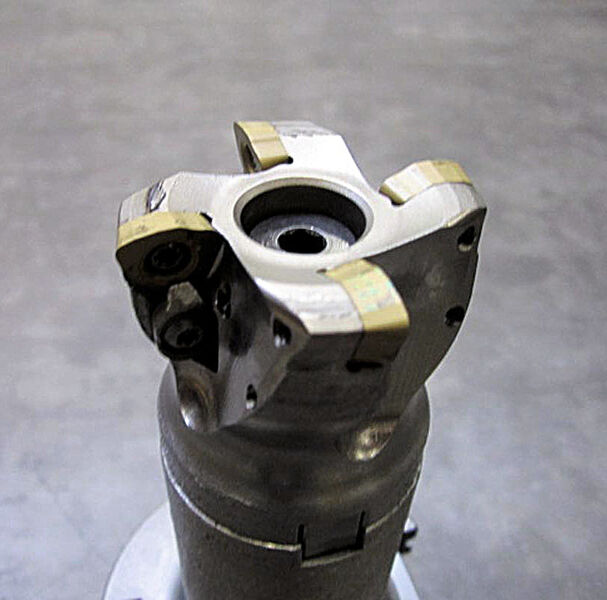 The testing was conducted with an AJX052 high-feed milling cutter from Mitsubishi and the JDMW 120420 ZDSR-FT-FH7020 coated insert . (Source: Arcelor Mittal)