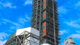 Sixteen-foot diameter ductwork takes flue gas from the coal plant to the carbon caption facility where the CO2 is removed from the flue gas by the amine solution in the tall absorption tower and then separated from the amine as 99.9% pure CO2 in the smaller regenerator tower to the right before being compressed and delivered to the oil field. (Business Wire)
