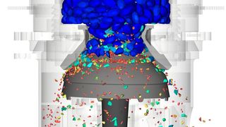 Simulation der Partikelzerkleinerung auf einem Brecher, der Zerkleinerungsgrad wird durch die unterschiedlichen Farben dargestellt. (Bild: Cadfem)