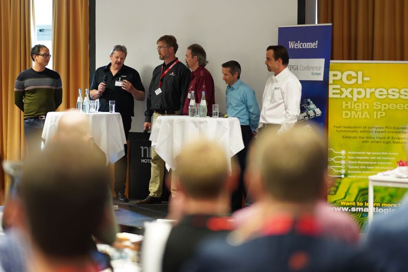 FPGA Conference Europe 2022: Über 70 Sprecher, 100 Vorträge und über 250 Teilnehmer – nach zwei Jahren mit Corona-bedingten Digitalkonferenzen fand die dreitägige FPGA Conference vom 5. bis 7. Juli 2022 endlich wieder als Präsenzveranstaltung statt. Besondere Highlights waren die spannende Keynote von Nick Ni von AMD/Xilinx, die interessante Couchtalk-Expertenrunde, der traditionelle BBQ-Grillabend sowie die vielen glücklichen Gewinner der Verlosungsaktionen.  (Bild: Nadine Stegemann)