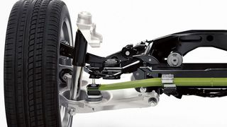 JEC-Highlight von Henkel: Die hintere Achse des neuen Volvo XC90 ist mit einer neuartigen Querblattfeder aus leichtem Faserverbundwerkstoff ausgerüstet (grüngelbes Teil). Benteler-SGL fertigt diese gewichtssenkenden Blattfedern zur Hinterradaufhängung in hohen Stückzahlen aus einem Faserverbundwerkstoff mit einem Loctite Matrixharz von Henkel. (Bild: Henkel)