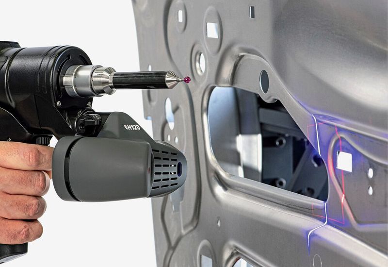 An LK 7-axis Freedom measuring arm deploying an H120 laser scanner to inspect a car door. (Source: LK Metrology)
