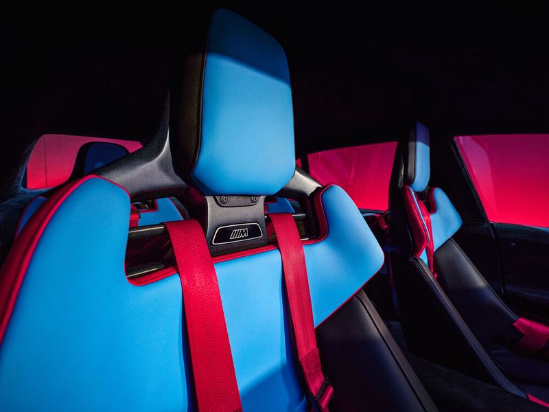 Red five-point harnesses secure drivers and passengers in newly designed bucket seats. (Image:BMW)