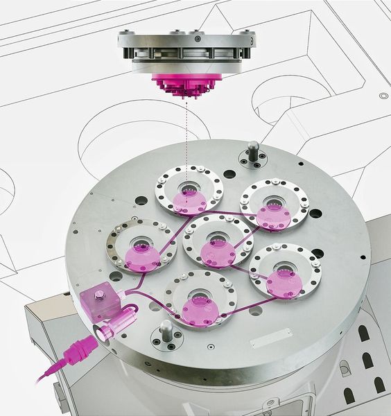 A typical Stark.intelligence 5-axis milling set-up for automated loading, accommodating six Stark.classic zero-point elements with sensor boxes and a master unit with IO-Link coupler. (Source: Roemheld)
