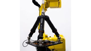Renishaw's robotic diagnostic system for industrial automation, the RCS T-90, fitted within a working robot cell. (Source: Renishaw)