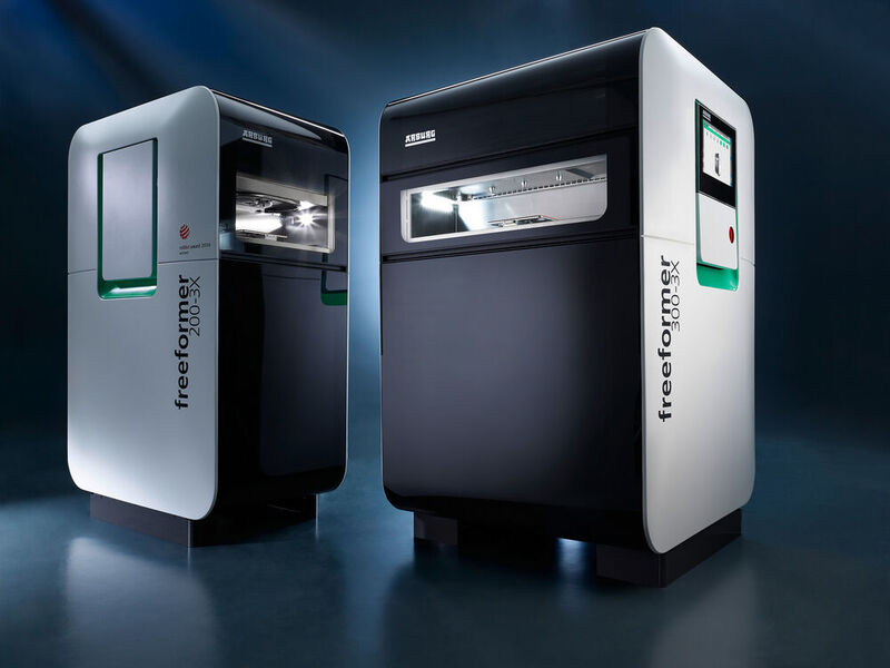 The Freeformer 300-3X (right) from Arburg celebrated its premiere at Formnext 2018. The machine is built for the additive manufacture of complex, resilient functional parts in hard/soft combinations. (Arburg)