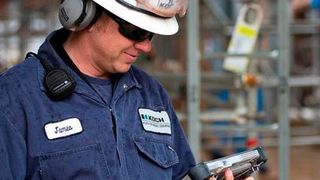 Employee working with analytics data. (Business Wire)