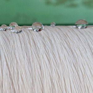 Thanks to plasma technology, organosilicon compounds have been successfully used to produce water-repellent textiles. (Source:  Empa)