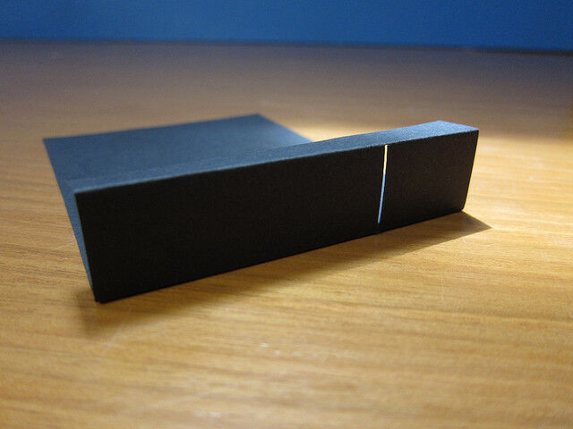 Put the card in the box, and cut a larger opening in the VHS case to expose the slit. (PLOTS/CC BY 2.0)