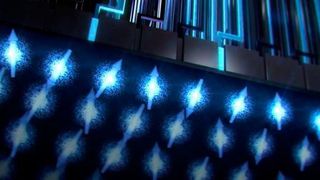 Künstlerische Darstellung der Architektur eines Silizium-CMOS-Chip-Architektur für einen spinbasierten Quantencomputer: Oben sind hauptsächlich Standard-CMOS-Komponenten und unten die in Betrieb befindlichen Quantenbits zu sehen. (Bild: Tony Melov)