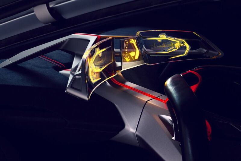 Hinter dem Volant, das mit zwei kleinen Monitoren versehen ist, findet sich ein transparenter, gebogener Bildschirm, durch den man auf die Windschutzscheibe blickt. (BMW)