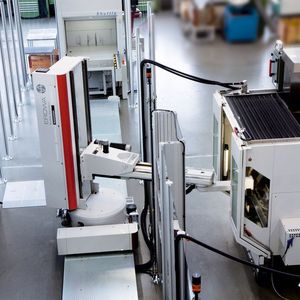 Erowa robot loading a machine tool.