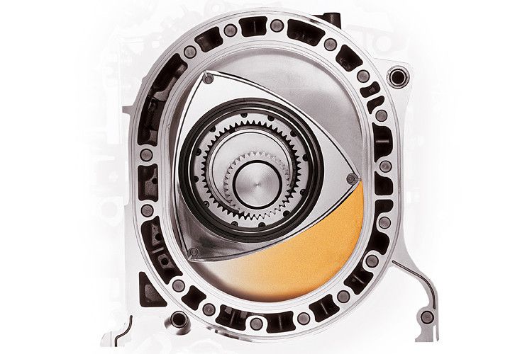 ... dem Verbrennungstakt. Die dabei entstehende Energie geht direkt in eine Drehbewegung der Excenterwelle über. Im Anschluss ... (Mazda)