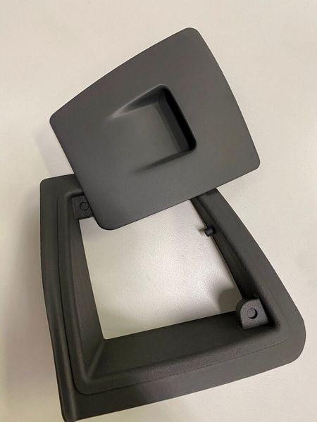 Rectangular structure frame and the wipers washer reservoir flap valve in Windform LX 3 0. (CRP Technology)