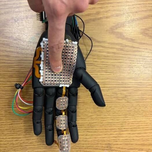 A robotic hand fitted with 3D-printed sensor module developed by the research team from Washington State University. The electronic skin can detect pressure and temperature at a fine level, laying the groundwork for bionic skin that could be used on prosthetics to help amputees and others.(Source:  Sravanthi Yalamanchili/ WSU)