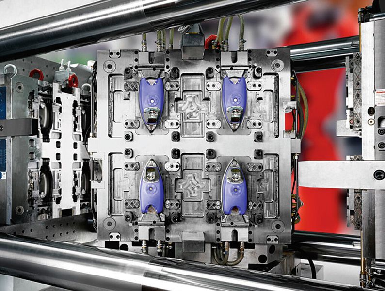 Before one can press a shirt, the iron parts have to run through a press, and a number of cycles for multiple component injection. (Source: Concept Laser)