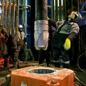 Workers drill with a diamond-studded drill head at the Achimgaz gas drilling well in Novy Urengoi, Siberia, Russia.