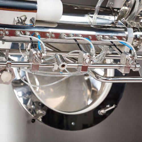 Automatic extendable spray arm with self-adjusting movable spray nozzles allows efficient tablet coating for variable batch sizes from 10 to 100 %. Automatic extendable spray arm with self-adjusting movable spray nozzles allows efficient tablet coating for variable batch sizes from 10 to 100 %.