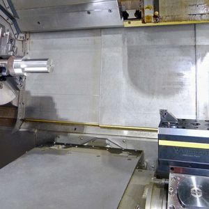 A Vibrocut toolholder mounted in a driven station of a lathe turret. It delivers reciprocating motion to a static cutting tool to promote chipbreaking.(Source:  Nydaloxe Precision)
