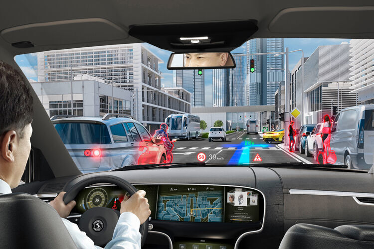 Das Head-up-Display wird genutzt, um im Sichtfeld des Fahrers virtuelle Hinweise einzuspielen, die sich in seine Straßenansicht einfügen, wie hier von Continental gezeigt. (Continental)