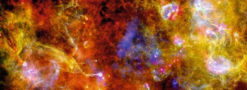 Wolken aus interstellarem Staub und Gas, hier in der Region „Cygnus-X“ im Sternbild Schwan.  (ESA/PACS/SPIRE/Martin Hennemann & Frédérique Motte, Laboratoire AIM Paris-Saclay, CEA/Irfu – CNRS/INSU – Univ. Paris Diderot, France.)